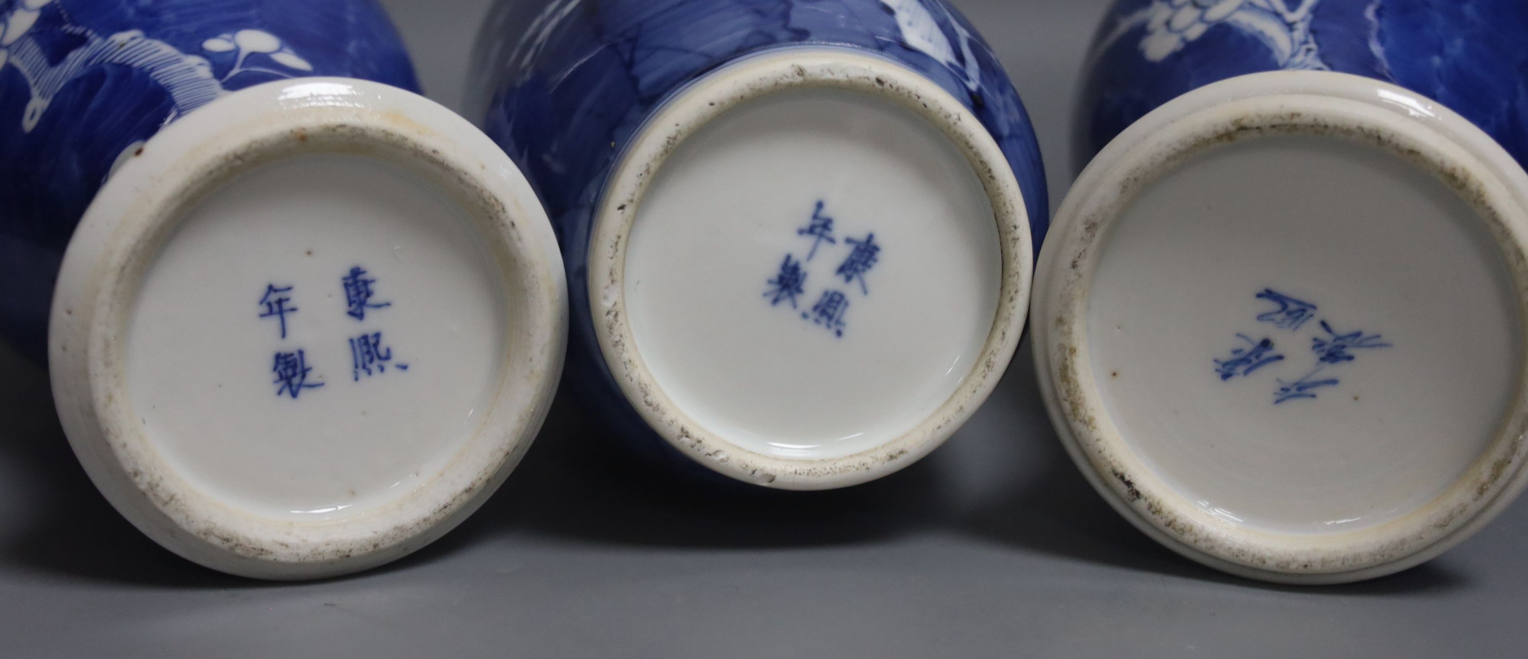 Three Chinese blue and white prunus vases. 25.5cm